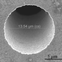 Scanning electron micrograph of a pinhole aperture in 70 &mu;m thick gold.