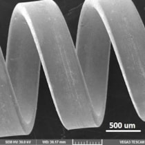 Scanning electron microscopy image of a tungsten helix with 5 &mu;m copper layer uniformly electroplated onto inner and outer surfaces.