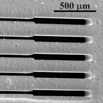 Scanning electron micrograph of an X-ray mask with 50 &mu;m wide and 30 mm long slits in 150 &mu;m thick gold.