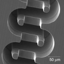 Scanning electron micrograph of a solid copper two-level waveguide circuit for THz radar system.